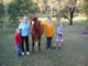 Kids in front of fruit trees