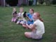 Kids holding Silky chicks - two were eaten by a fox