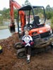 Doug in front of bobcat at Church Rd